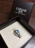 Серебряное кольцо с голубым топазом и фианитами - Николаев