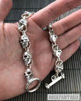Серебряный мужской браслет с черепами с натуральными гранатами - Киев